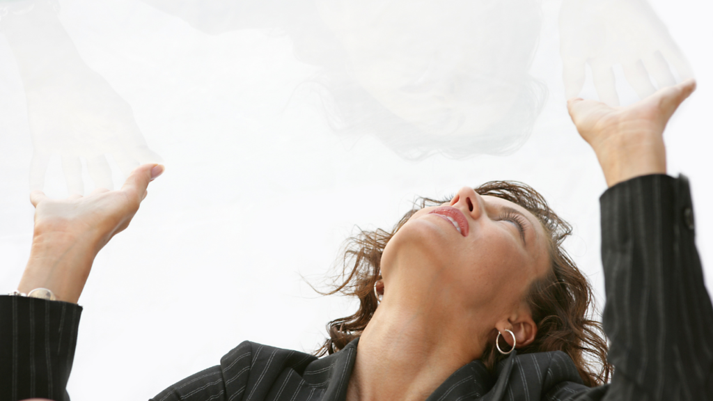 Woman stuck beneath a glass ceiling.